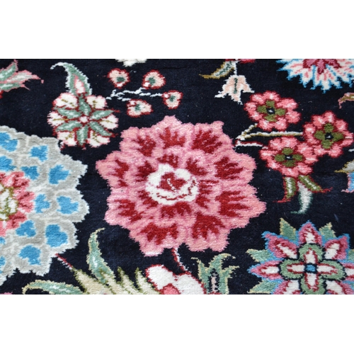 73 - Fine quality modern Persian silk carpet with a lobed medallion and all-over stylised floral design o... 