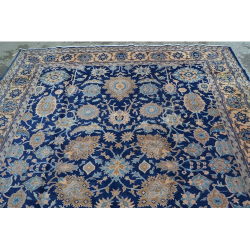 75 - Sparta carpet with an all-over palmette design on a midnight blue ground with borders, 12ft x 9ft ap... 