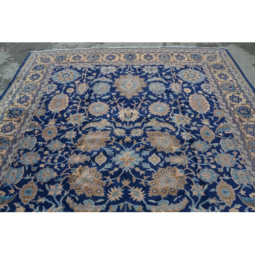 75 - Sparta carpet with an all-over palmette design on a midnight blue ground with borders, 12ft x 9ft ap... 