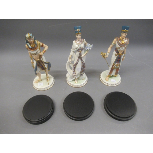 767 - Set of three Wedgwood Egyptian figurines of Akahenaten, Tutankhamun and Neferititi on wooden stands