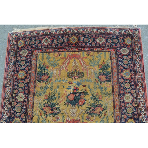 79 - Unusual Abadeh rug with a stylised floral design on a yellow ground with borders, 4ft 6ins x 3ft 8in... 