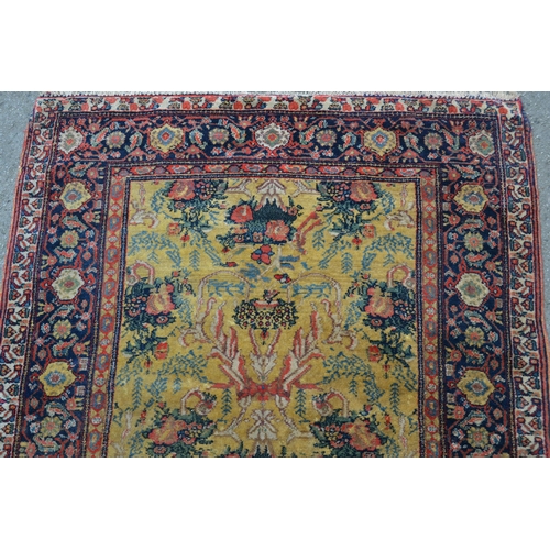 79 - Unusual Abadeh rug with a stylised floral design on a yellow ground with borders, 4ft 6ins x 3ft 8in... 