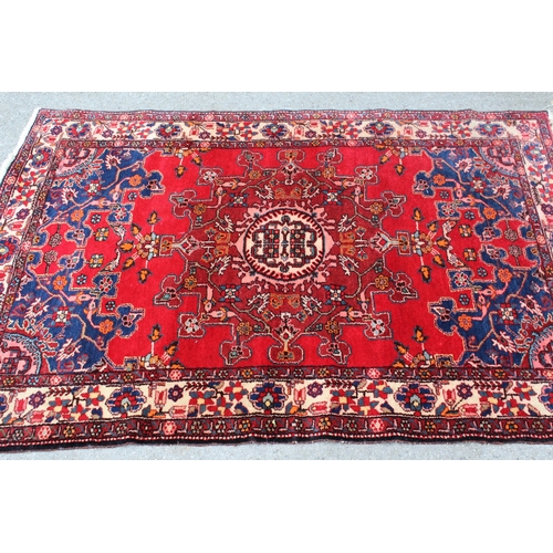 8 - Tabriz rug with a medallion design on a red ground, with blue corner designs and borders, 6ft x 4ft ... 