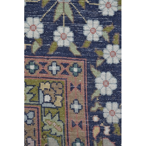 80 - Kashmiri part silk rug with a lobed medallion and all-over floral design on an ivory ground with mid... 
