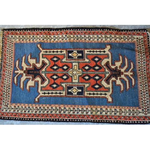 82 - Small Soumak mat with a polychrome banded design, 3ft 5ins x 2ft approximately, together with two si... 