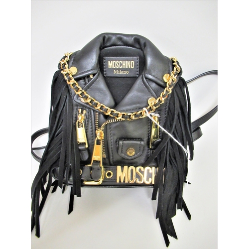 89 - Moschino, mini biker jacket black leather backpack / mini handbag having gold tone hardware