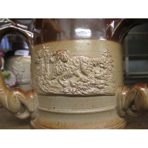 683 - 19th Century salt glazed mug with relief moulded animal decoration and three greyhound handles, 5ins... 