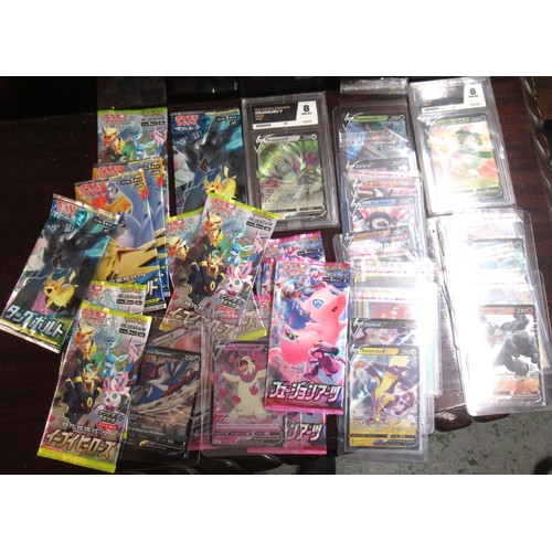 266 - Collection of various Pokemon cards and two Poke balls