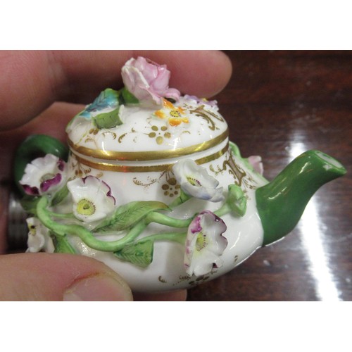 719 - Duesbury Derby miniature floral encrusted sander, together with another similar, painted with a land... 