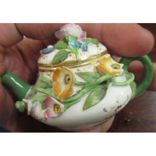 719 - Duesbury Derby miniature floral encrusted sander, together with another similar, painted with a land... 