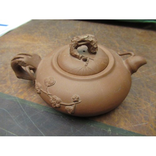 854 - Four various small Chinese terracotta teapots, two saucer dishes, a crackleware dish and four ladles... 