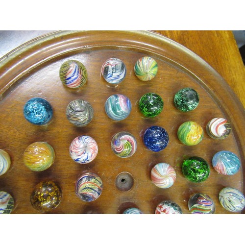 284 - Solitaire board and a collection of antique marbles