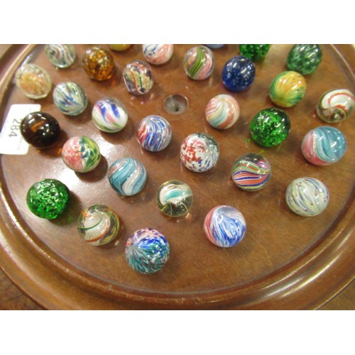 284 - Solitaire board and a collection of antique marbles