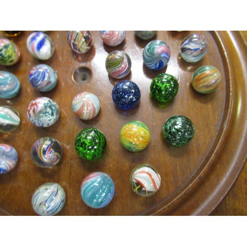 284 - Solitaire board and a collection of antique marbles