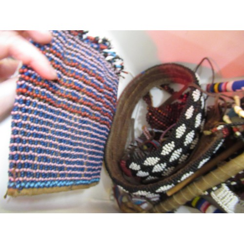 370 - Box containing a large collection of various native beadwork items, including belts, necklaces etc.,... 