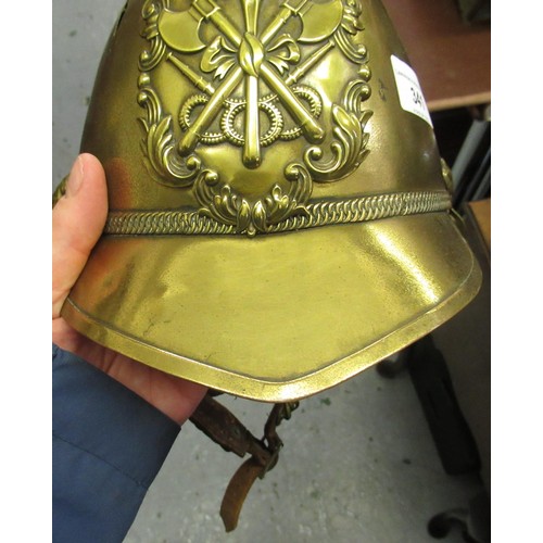 341 - 19th Century brass firemans helmet with crossed axes and hose emblem and original lining (with repai... 