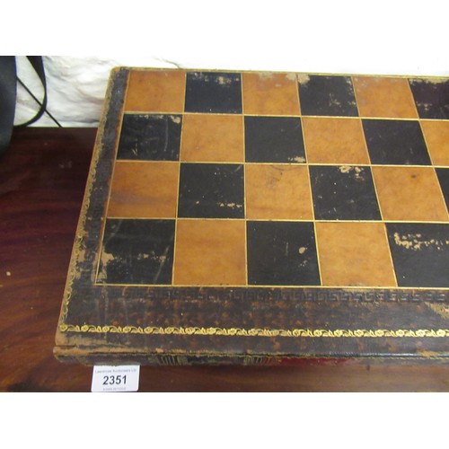 435 - 19th Century white and red stained turned bone chess set, in a folding leather covered box in the fo... 