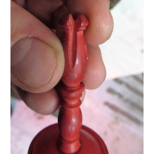 435 - 19th Century white and red stained turned bone chess set, in a folding leather covered box in the fo... 