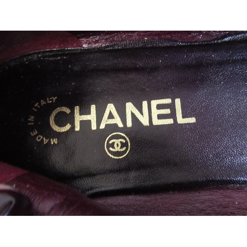 102 - Pair of ladies Chanel burgundy and black leather ballerina flats, size 40, together with one dust ba... 