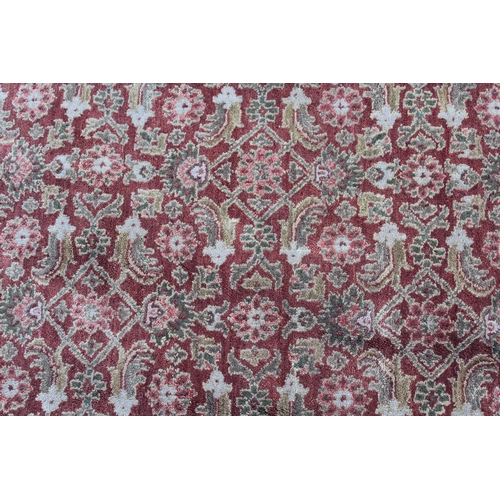 13 - Large Kashmir carpet with an all-over Herati design on a brick red ground with borders, 3.6m x 2.75m... 