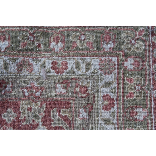 13 - Large Kashmir carpet with an all-over Herati design on a brick red ground with borders, 3.6m x 2.75m... 