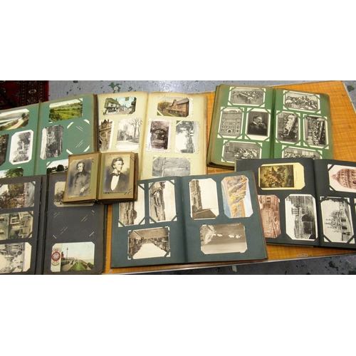 148 - Collection of various early to mid 20th Century British and Continental postcards, housed in seven v... 