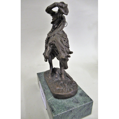 161 - Small bronze patinated figure of a cowboy on horseback on marble plinth, inscribed to the bronze ' R... 