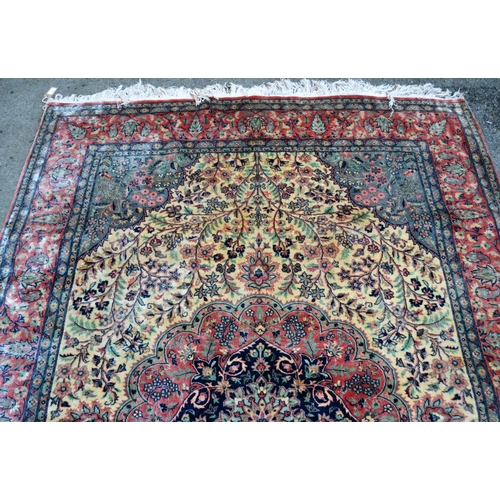 2 - Indo Persian rug with a medallion and all-over stylised floral design in shades of deep blue, pink a... 