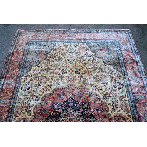 2 - Indo Persian rug with a medallion and all-over stylised floral design in shades of deep blue, pink a... 