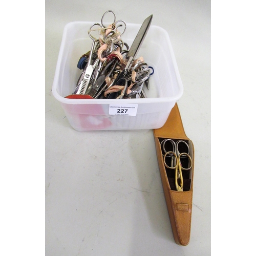 227 - Box containing a quantity of various scissors, including a leather scissor case