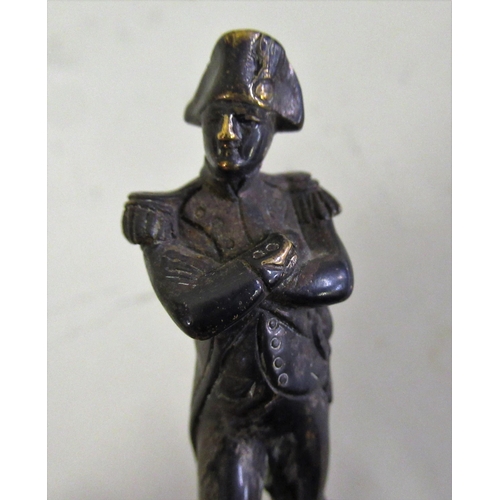 230 - Small 19th Century bronze figure of Napoleon, with remnants of plated finish, on an associated serpe... 