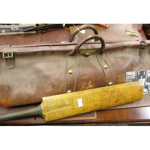 238 - Early 20th Century leather cricket bag, together with a cricket bat