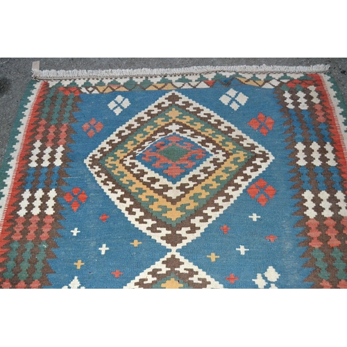 3 - Kelim rug with a triple medallion design on pale blue ground with borders, 213cms x 137cms approxima... 