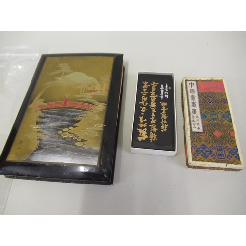 333 - Small Eastern lacquered postcard album containing views of Hong Kong and two painted postcards, toge... 