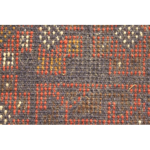 37 - Modern Afghan Belouch rug with an all-over stylised design in shades of deep red and dark blue, 200 ... 