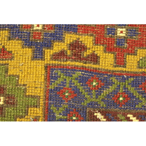 39 - Turkish carpet with a lobed medallion and plain design with red ground, blue ground corner designs a... 