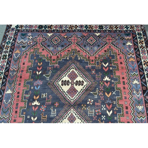 4 - Modern Persian Belouch style carpet with a triple hooked medallion, floral and bird design in shades... 