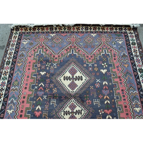 4 - Modern Persian Belouch style carpet with a triple hooked medallion, floral and bird design in shades... 