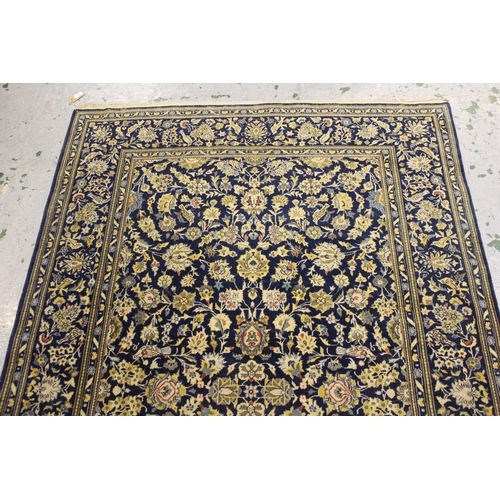 42 - Tabriz rug with an all-over palmette design on a midnight blue ground with borders, 214cms x 142cms ... 