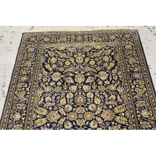 42 - Tabriz rug with an all-over palmette design on a midnight blue ground with borders, 214cms x 142cms ... 