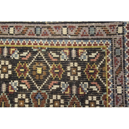 45 - Indo Persian runner with an all-over Herati design on a dark ground with narrow borders, 380cms x 74... 