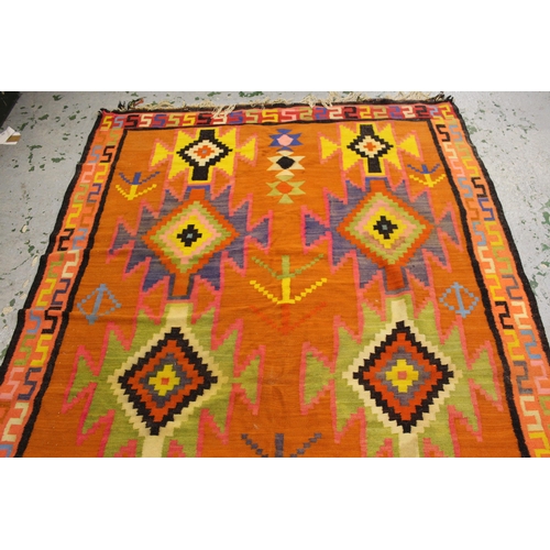 53 - Kelim rug with polychrome all-over geometric design on an orange ground, 286cms x 178cms, together w... 