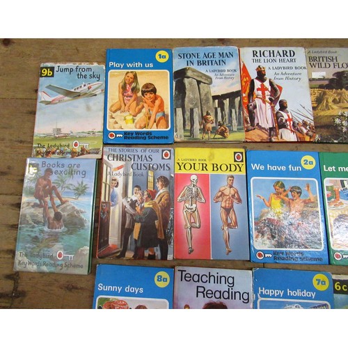 423 - Box containing a quantity of various children's books, including Biggles, Ladybird etc.