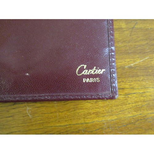 89 - Cartier burgundy leather wallet