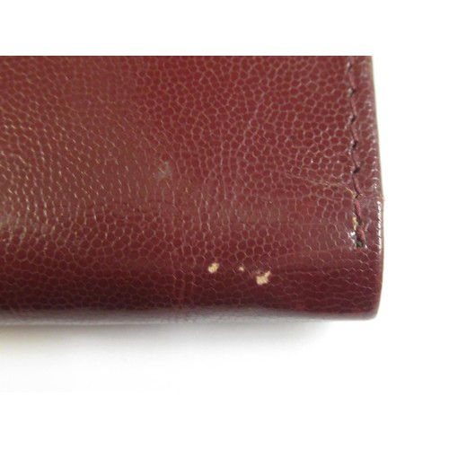 89 - Cartier burgundy leather wallet