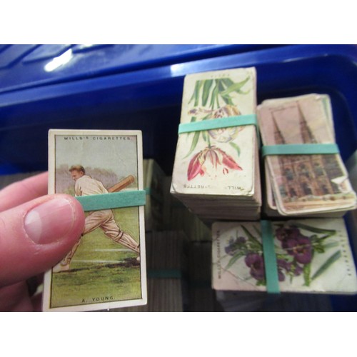 146 - Two blue boxes containing a large collection of various Wills, odd cigarette cards, including milita... 