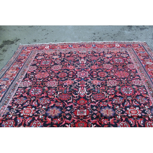 1 - Sarouk Mahal carpet with an all-over stylised flower head design, on a midnight blue ground with bor... 