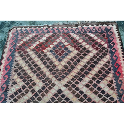 10 - Small Kelim rug with a twin medallion design, in shades of rose, pink, beige and brown, 20cms x 152c... 