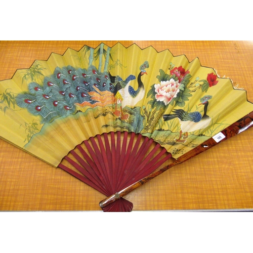 105 - Large Chinese lacquered fan, painted with exotic birds