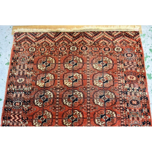 11 - Antique Tekke rug with three rows of eight gols on a wine ground with borders, 159cms x 113cms